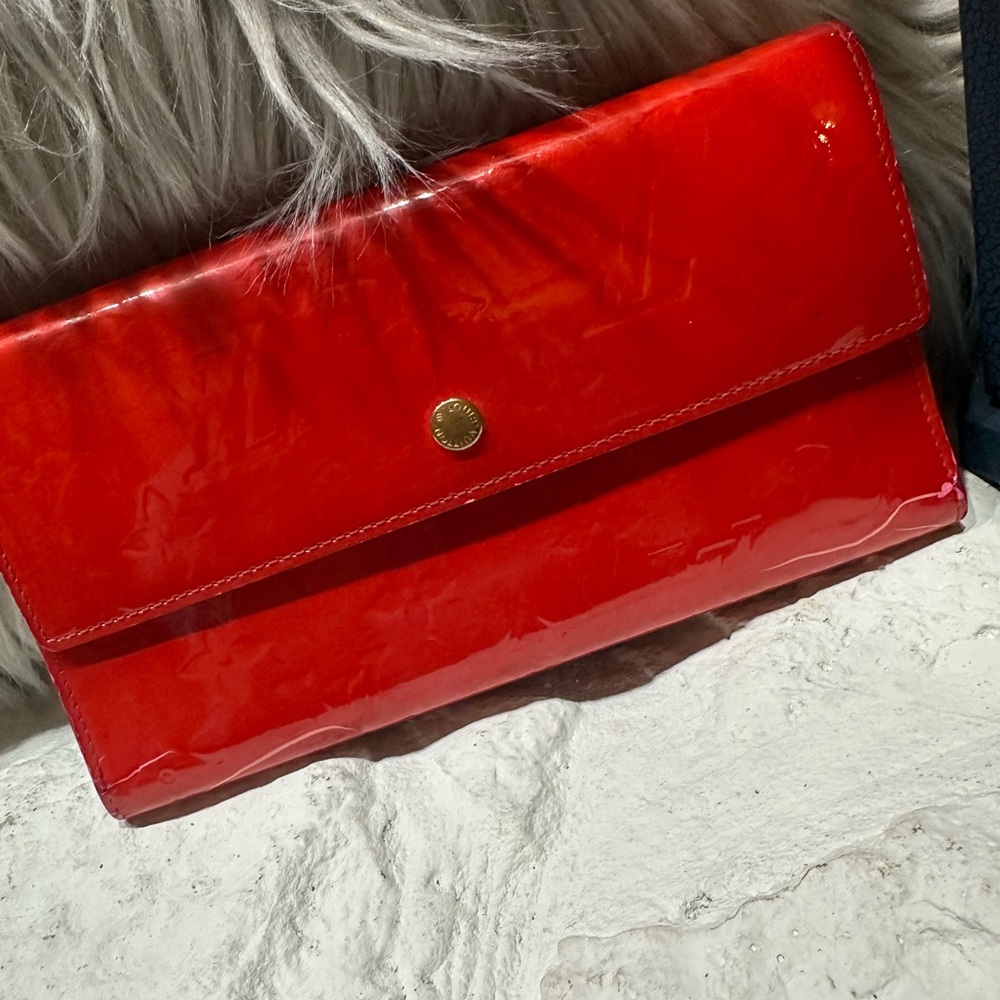 Authentic red orange Louis Vuitton  wallet.